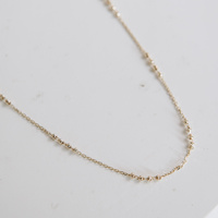 Naszyjnik złoty - delikatne kuleczki diamentowane 585