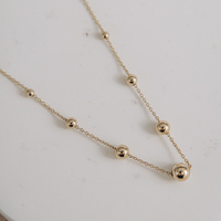 Naszyjnik złoty - kuleczki w różnych wielkościach 585