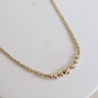 Naszyjnik złoty - diamentowane kuleczki w różnych wielkościach 585