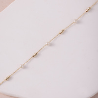 Bransoletka złota z kuleczkami i perłami - 585