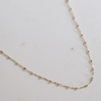 Naszyjnik złoty drobne diamentowane kuleczki 585