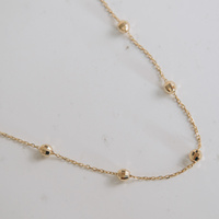 Naszyjnik złoty - diamentowane kuleczki 585