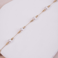 Bransoletka złota z kuleczkami oraz z perłą- 585